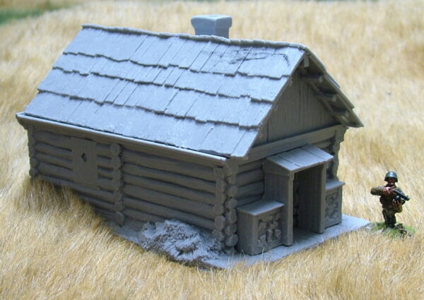 Large cabin with shingle roof and porch.