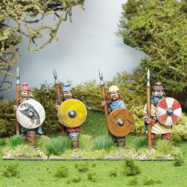 Duguth, (Veteran warriors) standing wearing caps with spears.