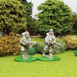 Home Guard wearing cap with Bren Gun advancing.