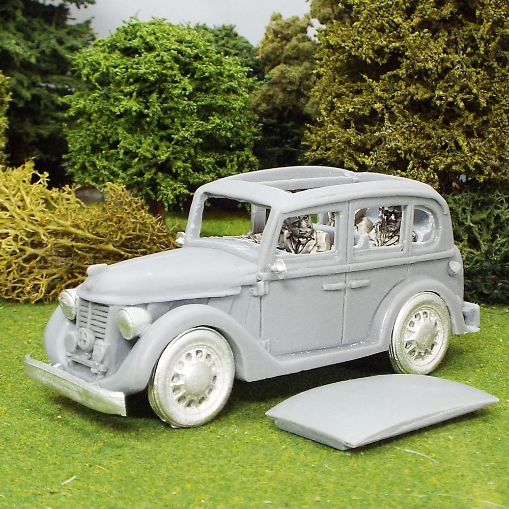 Sir Winston Churchill and aides in staff car with removeable roof.